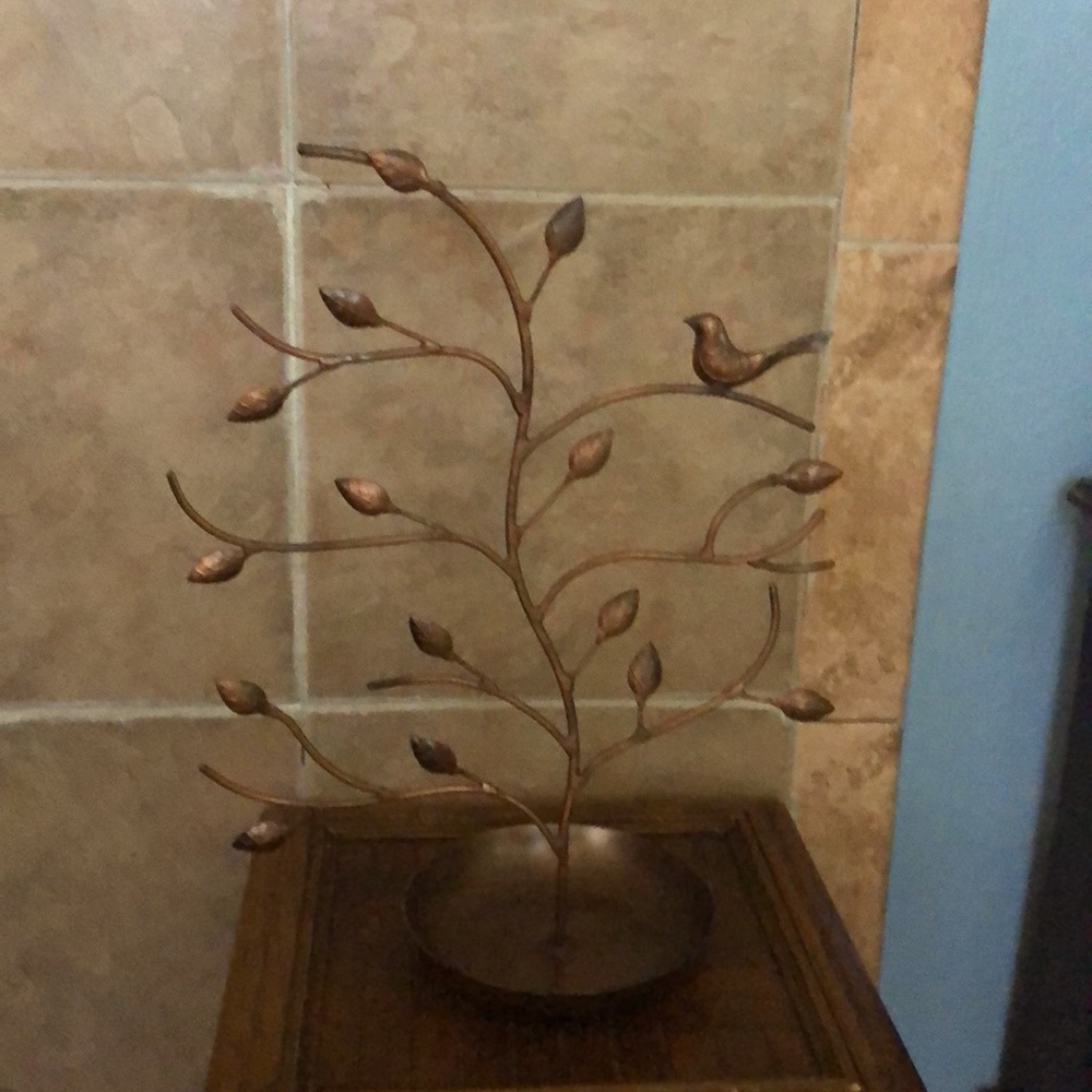 Copper color jewelry and bracelet holder.  Very sturdy with attached tray.